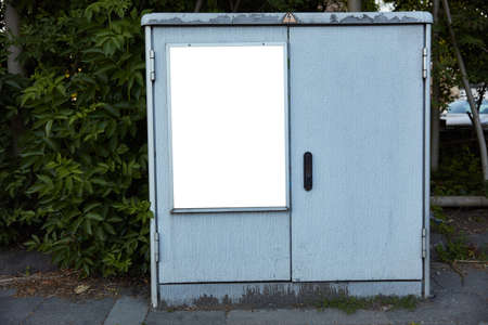 Poster poster mock-up template on control cabinet or distribution box in the city