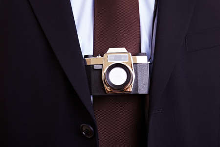 Businessman with toy camera around his neck