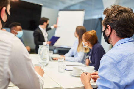Business team people look at presentation on whiteboard in a workshop