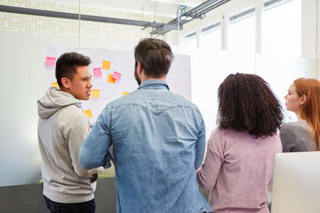 Business people or students in a brainstorming seminar or creative workshop