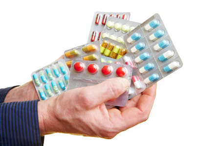 Hands hold a lot of colorful tablets