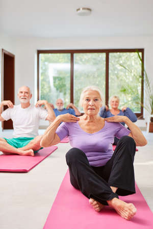 Seniors do exercise together in the physiotherapy rehabilitation courseの写真素材