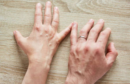 The fingers of a woman and man touch as a sign of love and togetherness
