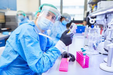 Chemist in the biotechnology laboratory works on Covid-19 vaccine for coronavirus pandemicの写真素材