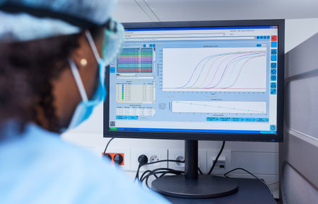 Researcher analyzing data on the computer in the laboratory at Covid-19 vaccine research
