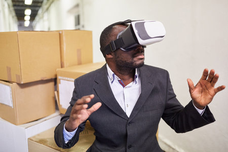 Manager in a factory with VR glasses to simulate the VR working world of the future