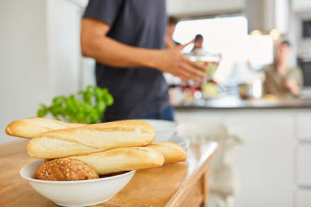 Baguette and rolls ready for dinner in a shared student kitchen