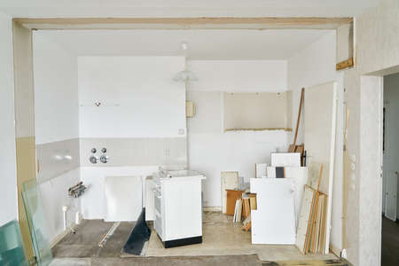 Renovation and repair of kitchen in condominium with a lot of bulky waste in the roomの写真素材