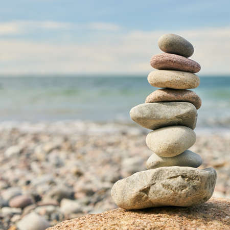 Stones as a stack balanced for Zen meditation on the beach