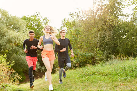 Young people cross-country skiing in nature as endurance and fitness training