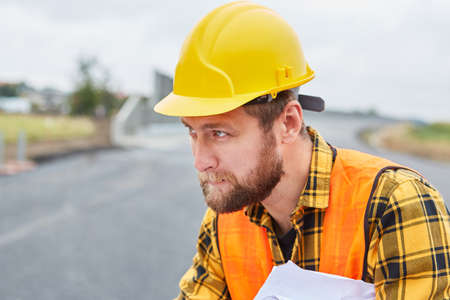Workers as foremen when building a house during the planning on the construction site in the new development areaの写真素材