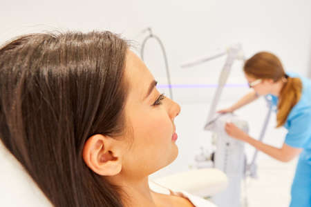 Young woman in beauty clinic or cosmetic studio waiting for skin treatment