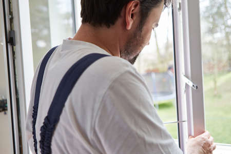Craftsmen as window fitters from a specialist company to hire windows in an apartment