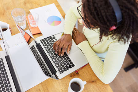 African American woman freelance working on laptop computer during a video conference online