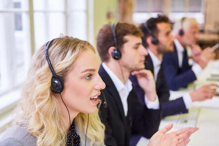 Group of business people or students in a training course for the call center hotlineの写真素材