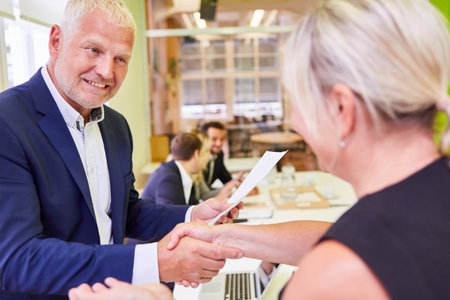 Business people at the handshake as a symbol for cooperation or as a congratulationの写真素材