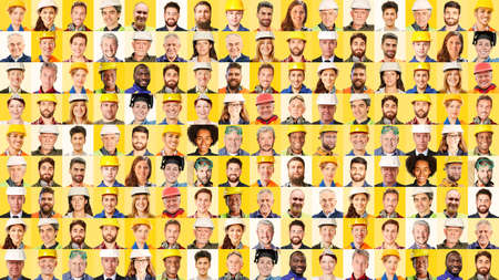 Panorama of employees from industry, construction and trade in front of a yellow backgroundの写真素材
