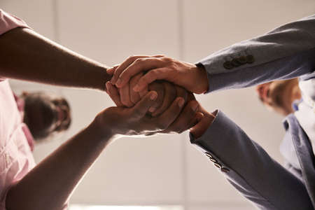 Shake hands between business people as a symbol for friendship and joint ventureの写真素材
