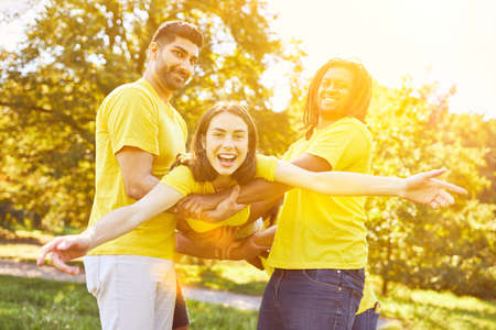 Woman Showing Confidence During Team Building Group Exercise In Natureの写真素材