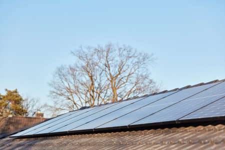 Modern solar system on the roof of a family house for renewable energy in a new building