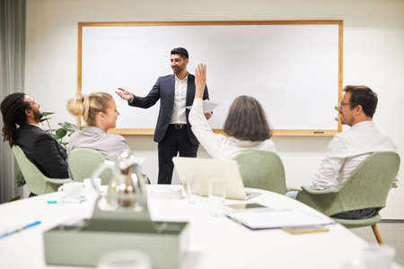 Questions and answers in the seminar or workshop to the speakers in the conference room in the...