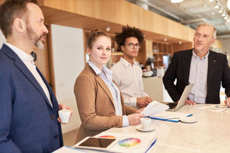 Group of business people as a creative designer team at the conference table in a meeting