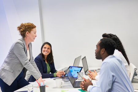 Business woman as a consultant together with an international team in a meeting