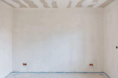 Wall patched after spatula work on the interior plaster when building a houseの写真素材