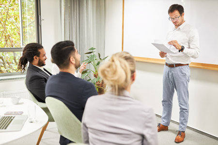 Business man as a speaker gives a presentation in a seminar or training in the office