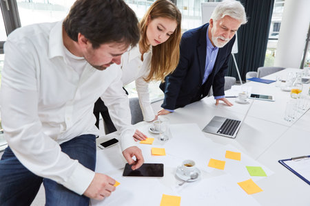 Business team at the conference table in a meeting during strategy planning