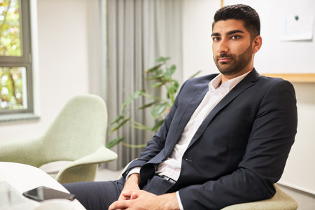 Young businessman as business trainee or job applicant in officeの写真素材