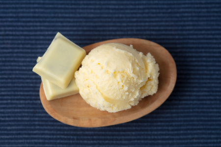 Fresh scoop of homemade white chocolate ice cream with pieces of chocolate from aboveの写真素材