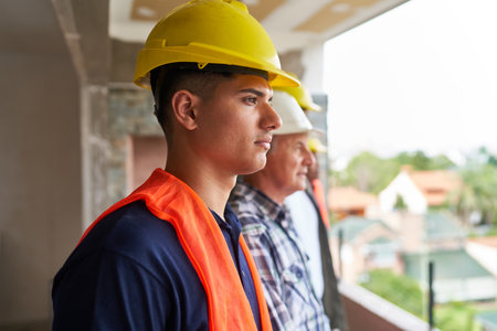 Young construction worker wearing safety workwear