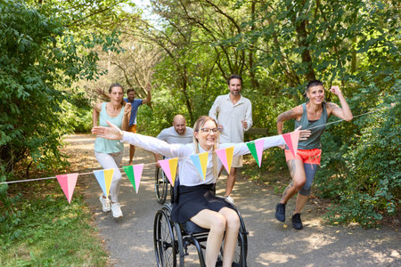 An inclusive outdoor event capturing a joyful race where a woman in a wheelchair competes with...