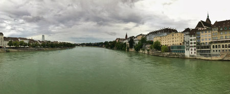 View of a river and its banks lined with historical buildings, captured as a panorama.の写真素材