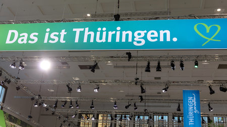 BERLIN, GERMANY, January 16th 2026: Photo of Image taken at the GrÃ¼ne Woche trade fair in Berlin Germany on January 16th showing a Thuringia banner with its logo and branding The banner is displayed with lighting and structural supports.のeditorial素材