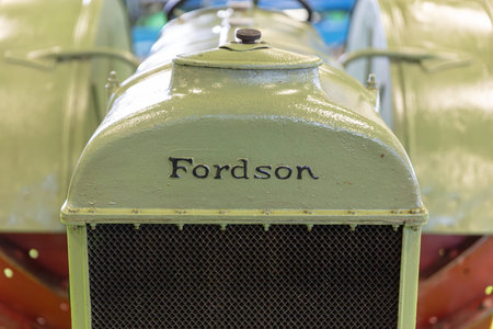 BERLIN, GERMANY, January 16th 2026: Photo of a vintage Fordson tractor painted in green is displayed at the Internationale GrÃ¼ne Woche trade fair in Berlin Germany. The image highlights the radiator grill and hood of the antique vehicle.のeditorial素材
