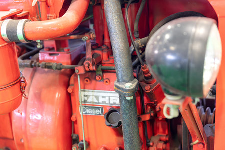 BERLIN, GERMANY, January 16th 2026: Photo of A close-up shot of a red Fahr diesel tractor engine is displayed at the Internationale GrÃ¼ne Woche trade fair in Berlin Germany The mechanical details and industrial design of the agricultural machinery.のeditorial素材