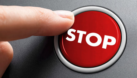 Stop button being pressed â€“ a symbol of control, risk management, safety, and the immediate halting of processes or critical situations