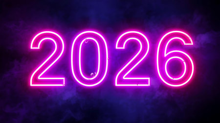 Glowing neon 2026 sign illuminates a dark background with vibrant purple and pink huesの素材