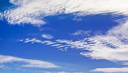 Deep blue sky with cloudsの写真素材