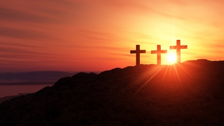 3 crosses on the hill at sunsetの写真素材