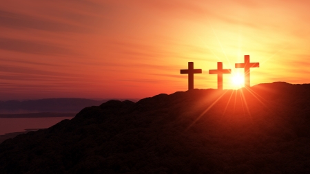 3 crosses on the hill at sunset