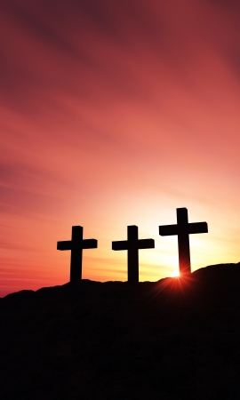 3 crosses on the hill at sunset - verticalの写真素材
