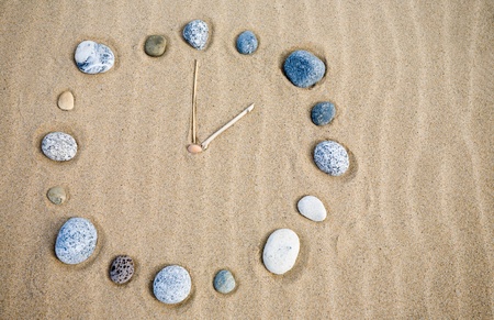 Natural watch on a sandの写真素材
