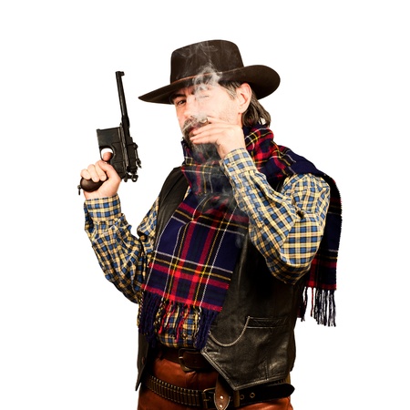 american cowboy with revolver, smoking cigar on white square backgroundの写真素材