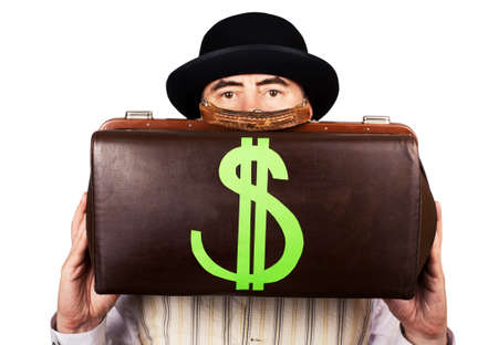 business person in a hat holding money bagの写真素材