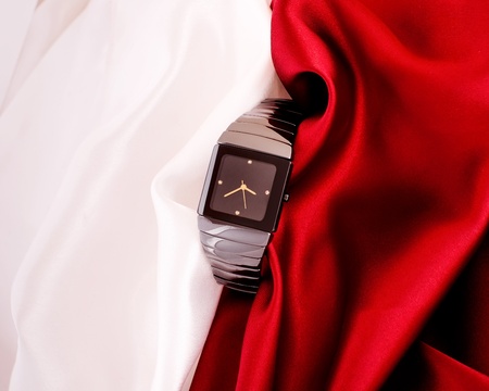 Men s mechanical watch on a background of red and white fabric の写真素材