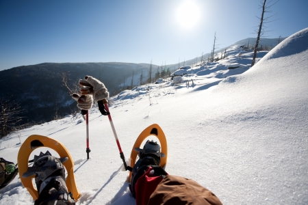 Hiker in winter mountains snowshoeingの写真素材