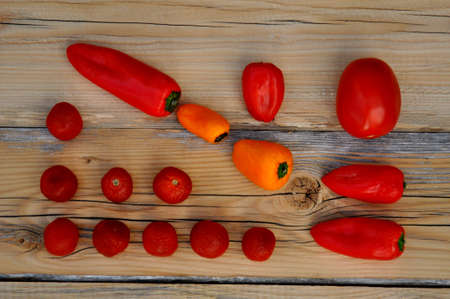 table with two colored peppersの写真素材